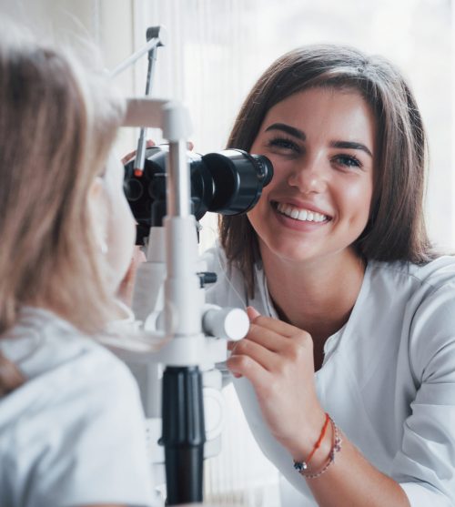 Process of diagnosing eye dysfunctions by female oculist with special equipment.