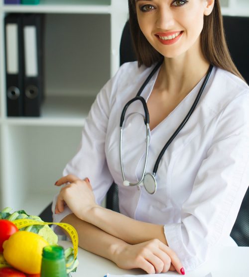 smiling-nutritionist-in-her-office