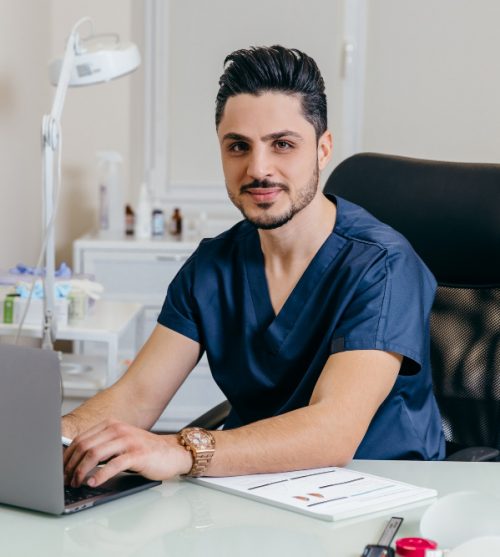 young-arabic-or-turkish-doctor-in-blue-uniform-conducts-online-counseling